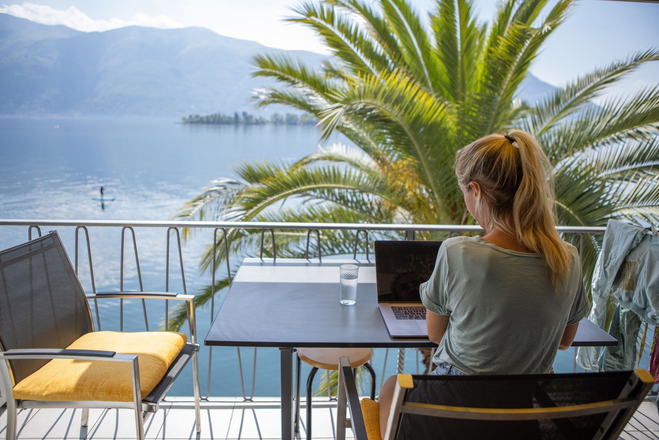 Digital Nomad working on her laptop while traveling abroad