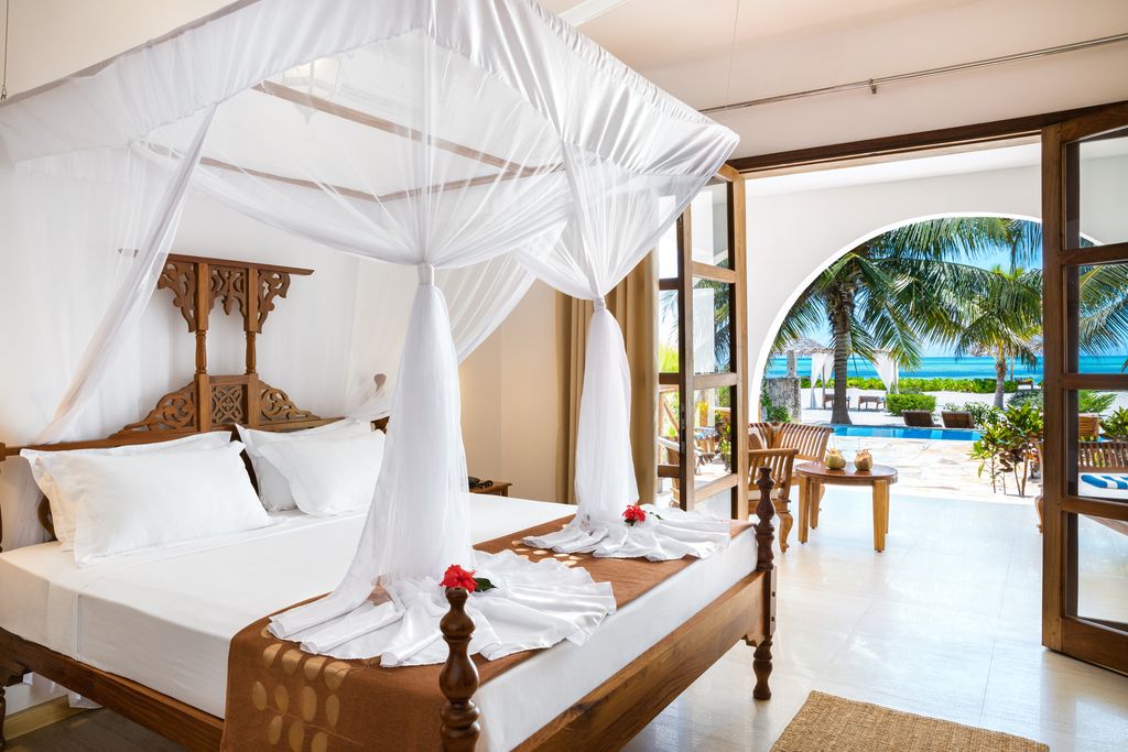 Opulent white bed in luxury hotel