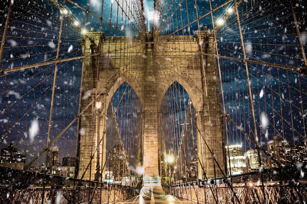 Brooklyn Bridge with snow falling