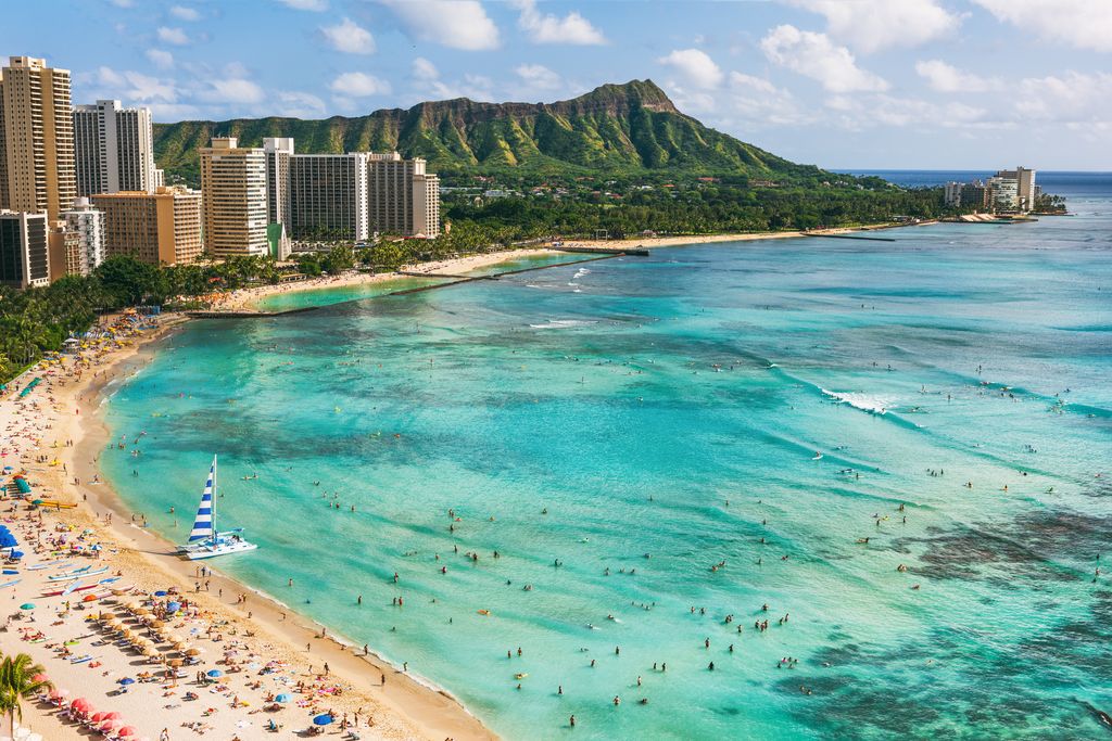 Waikiki beach and Diamond Head mountain peak at sunset, Oahu island, Hawaii.
