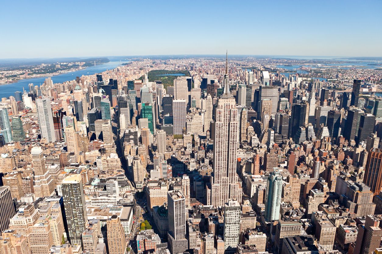Aerial Manhattan View with Empire State Building and Central Park in the background.