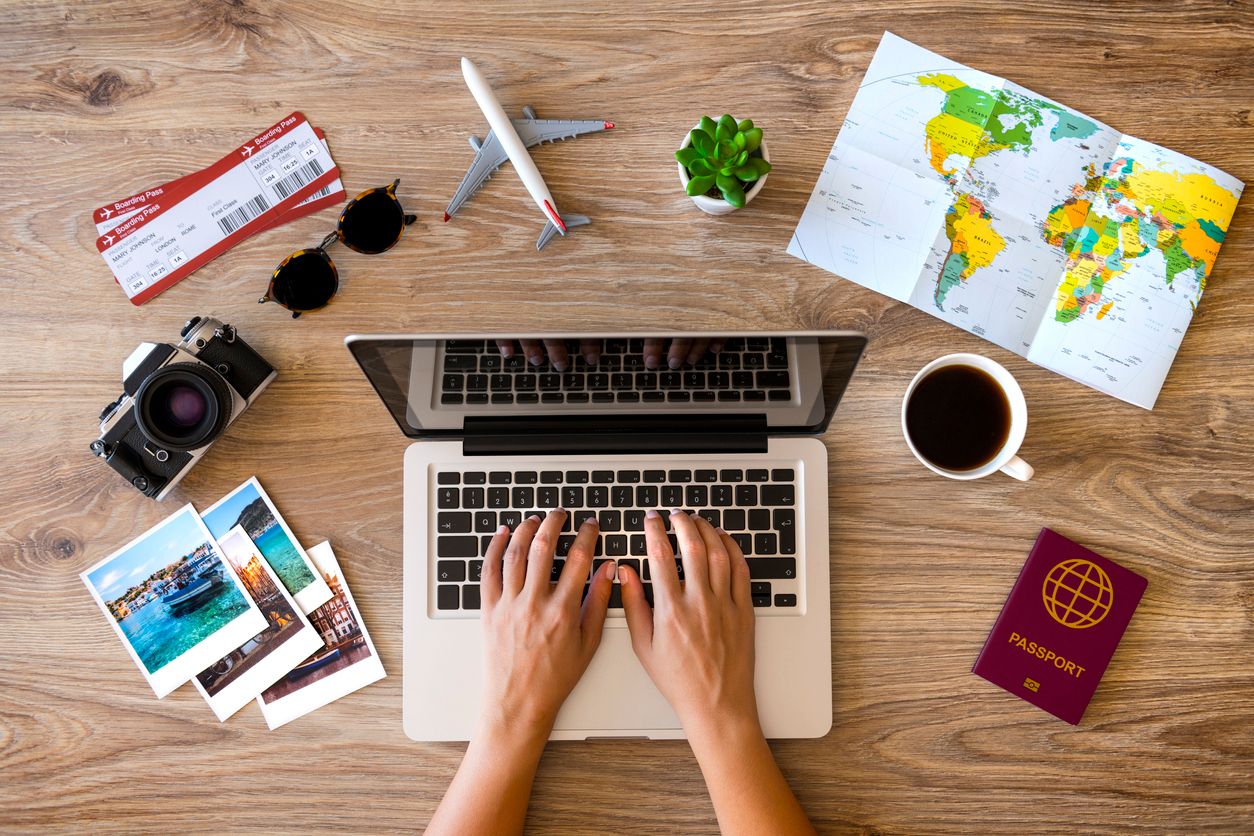Booking travel online on laptop