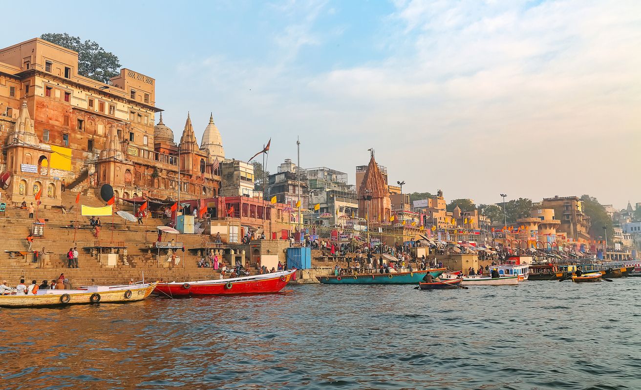 Varanasi ancient city architecture at sunset as viewed from a boat on river Ganges