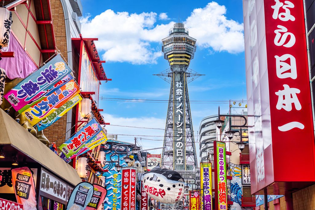Osaka Tower and view of the neon advertisements in Shinsekai district, Osaka