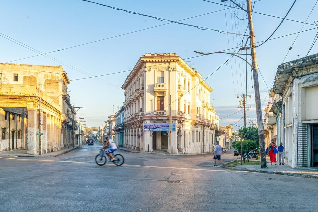 Flatiron style building in Havana, Cuba with electrical wires overhead