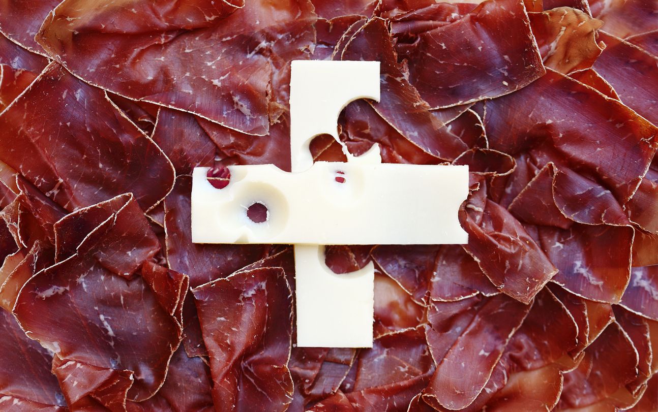 Switzerland's Flag made with Swiss specialties like thinly sliced dried meat and Emmentaler Cheese