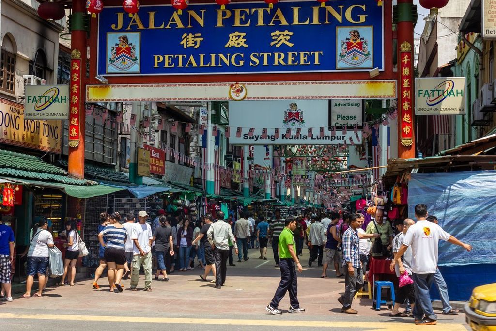 The crowded market street of Jalan Petaling in the old Chinatown area of the metropolitan city of Kuala Lumpur.