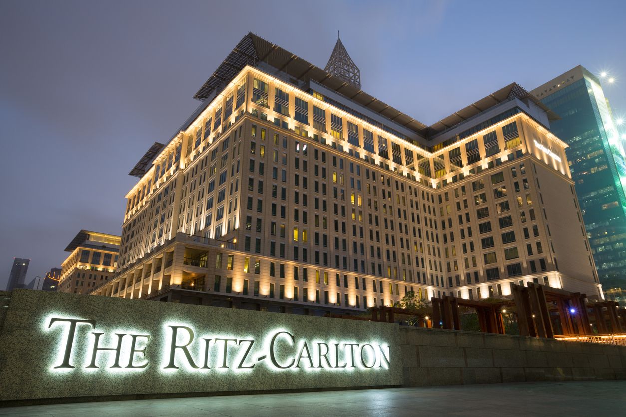 Ritz-Carlton Dubai with the brand name out front on the sign.