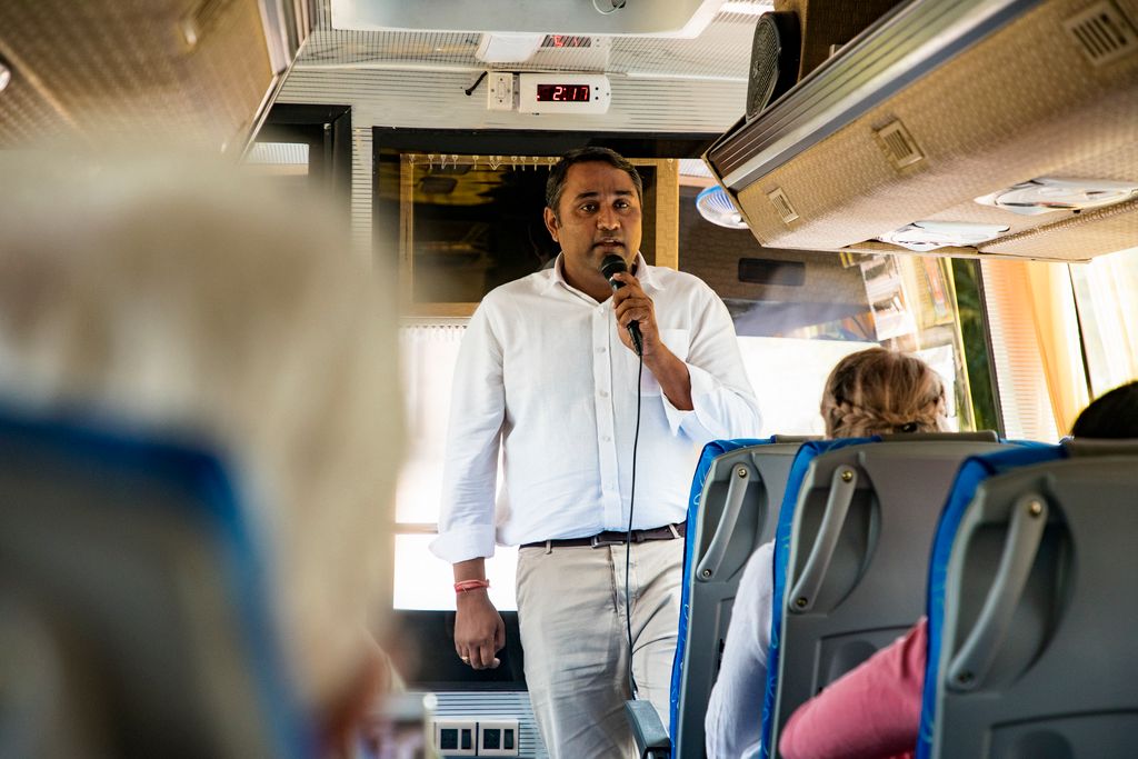 Professional Guide Talking to Tourists