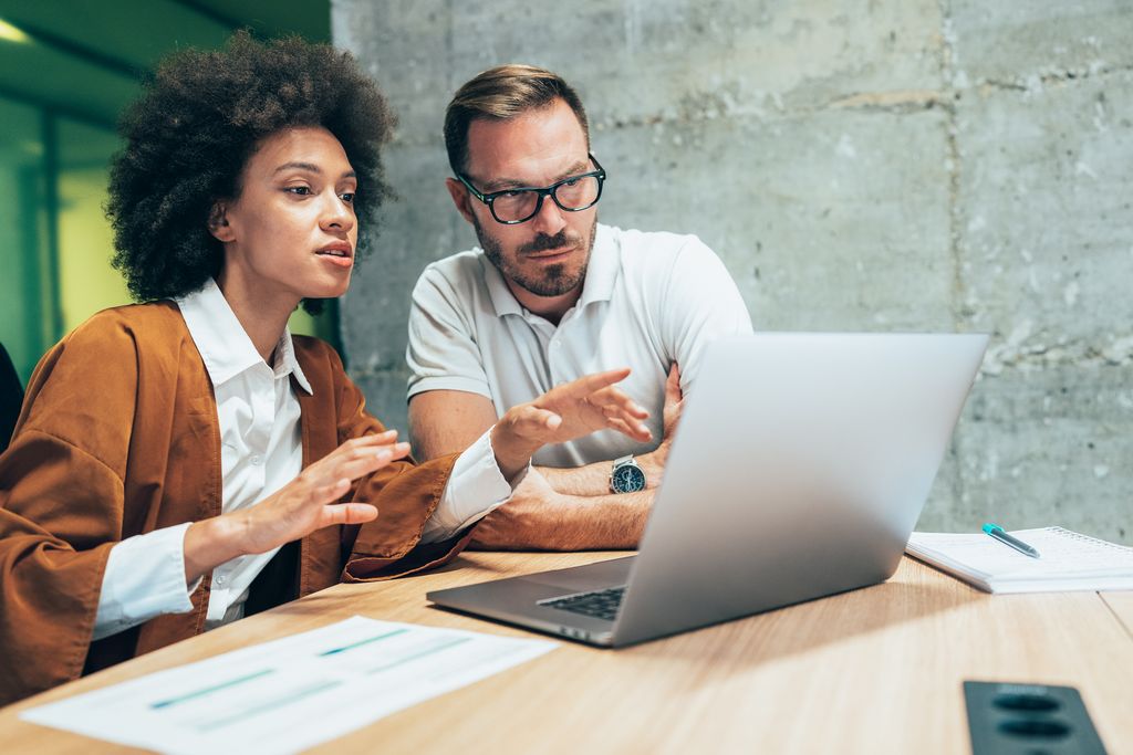 Two business people working together in office