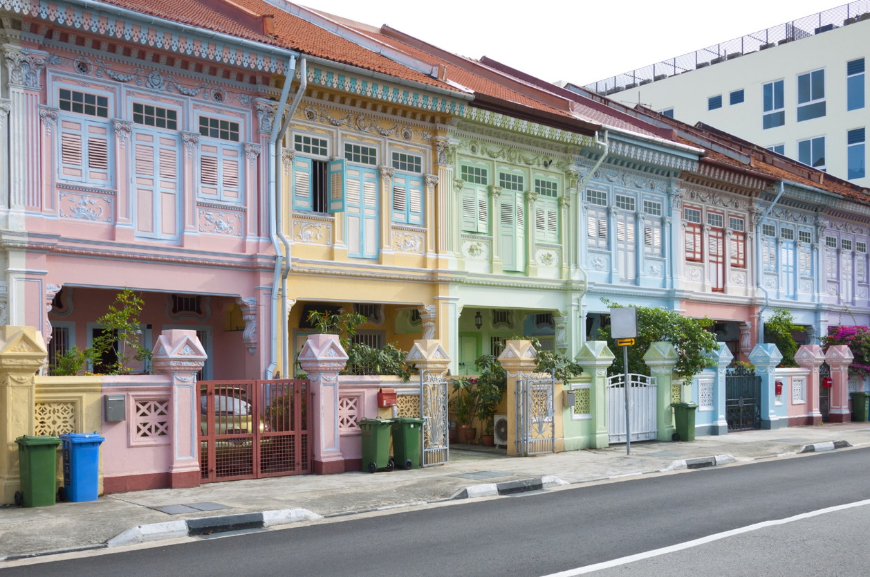 Street scene with historical homes in Singapore's Geylang district. The homes are very colorful and traditional.