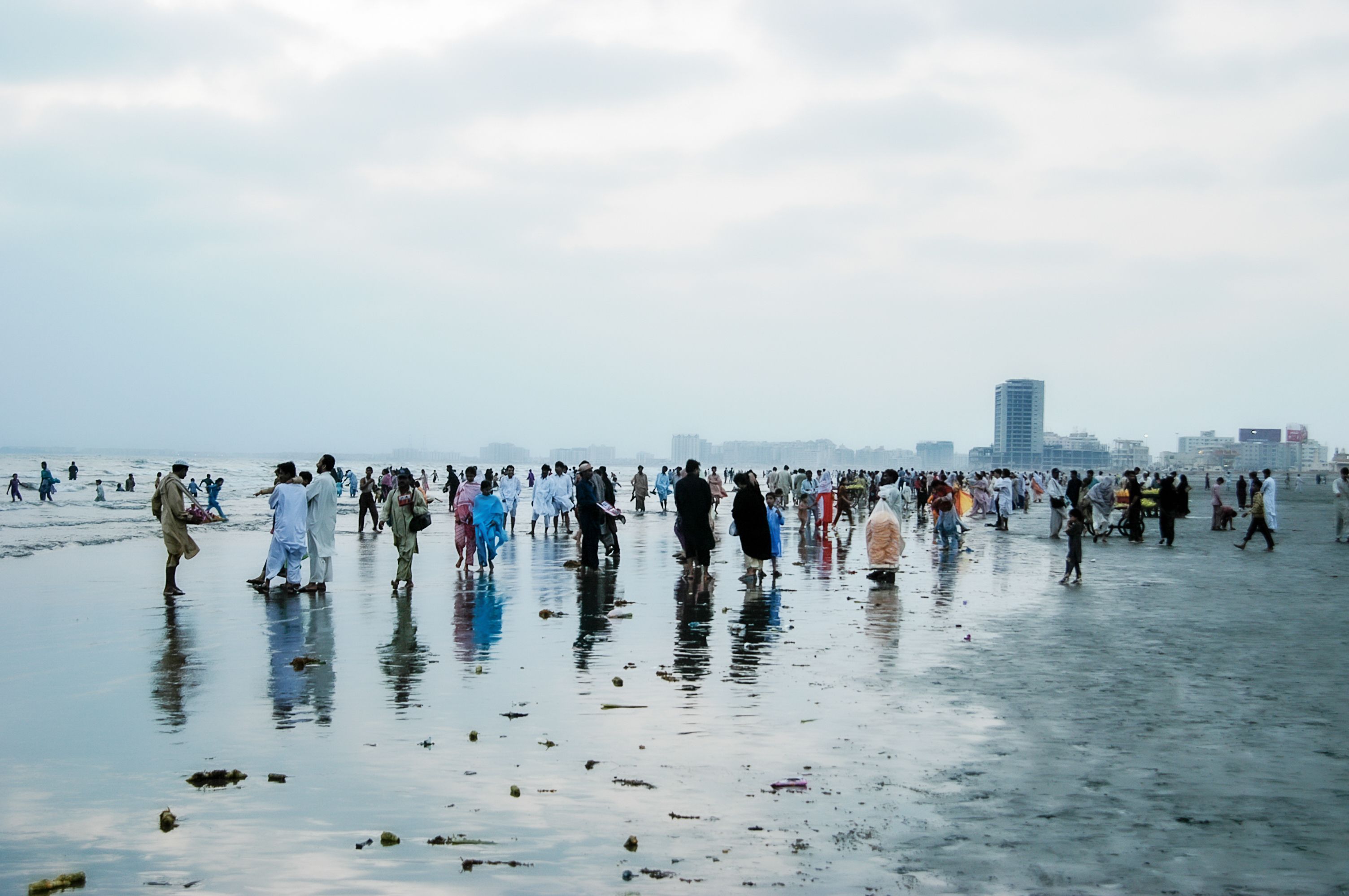 Pakistanis walking on the beach in Karachi