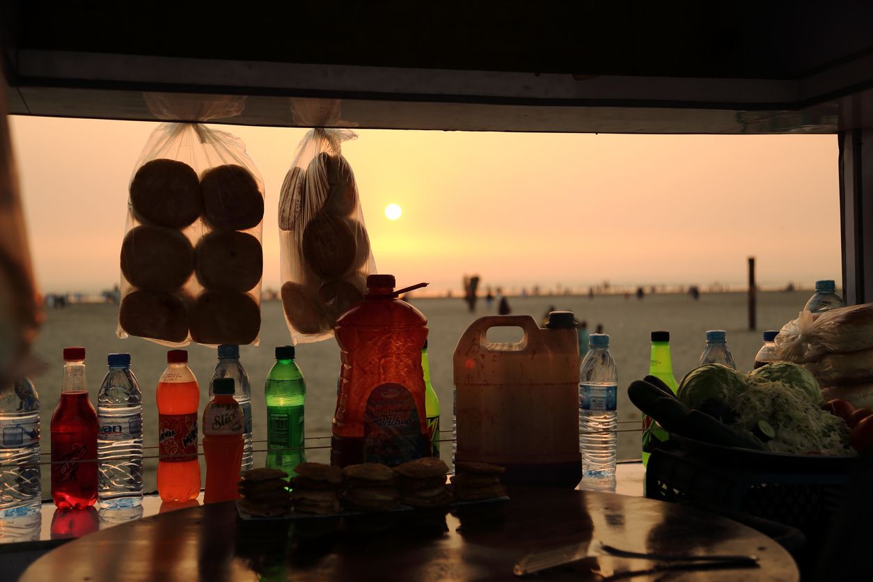 Bun Kebab seller with push cart at Clifton Beach, Karachi
