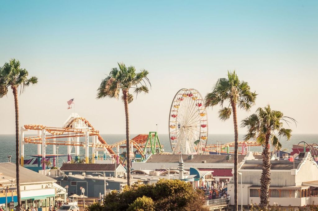 Famous amusement park with ferris wheel in Santa Monica, Los Angeles, California, USA.
