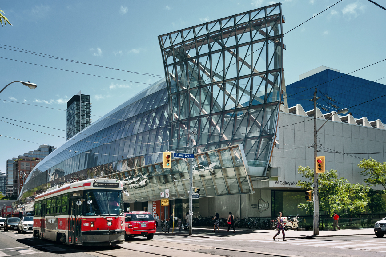 Street Car, cars and people pass in front of the Art Gallery of Ontario in downtown Toronto