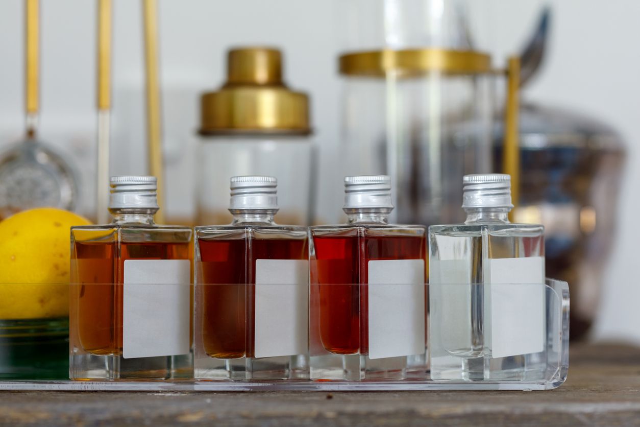 Assortment Of Small Liquor Bottles In Hotel Room.