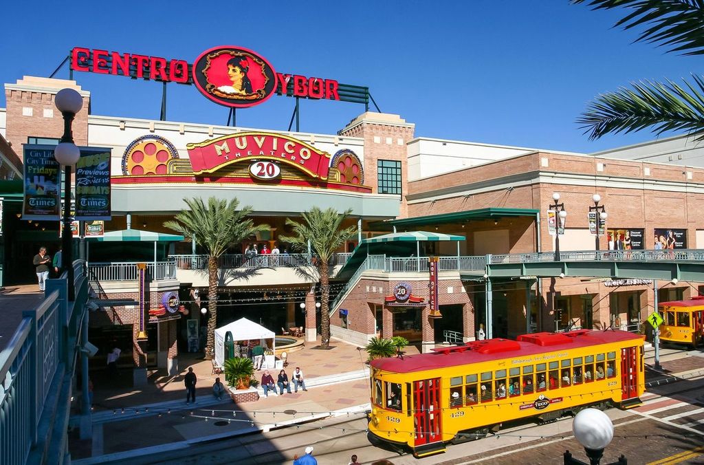 Centro Ybor entrance with yellow trams and visiting tourists