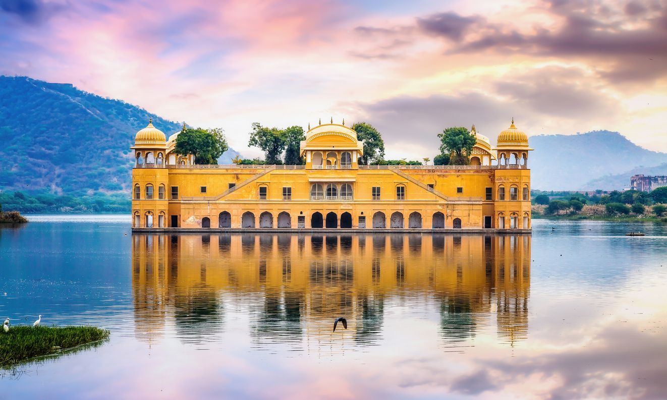 Jal Mahal water palace Jaipur Rajasthan with landscape at sunset