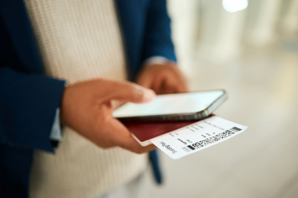 Phone, airport ticket and online booking concept