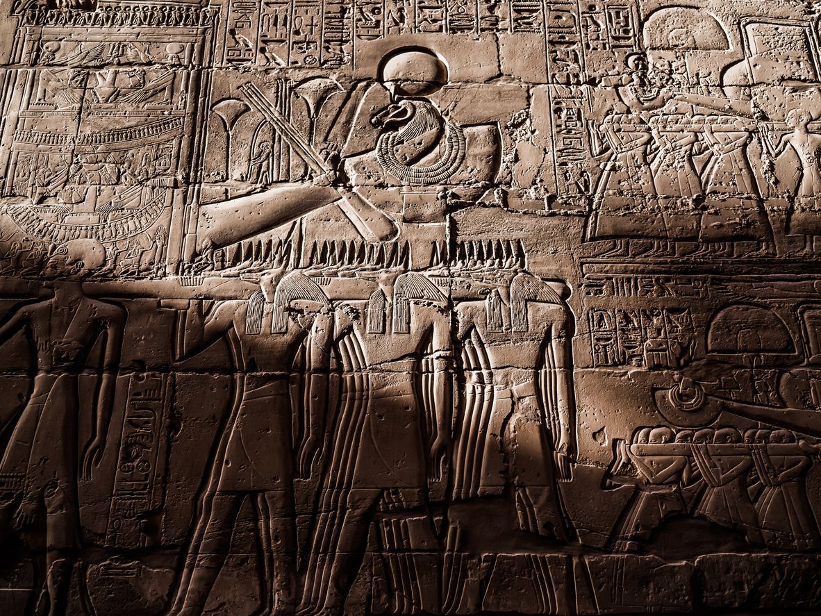 Close up view of ancient egypt hieroglyphics carved on a stone wall