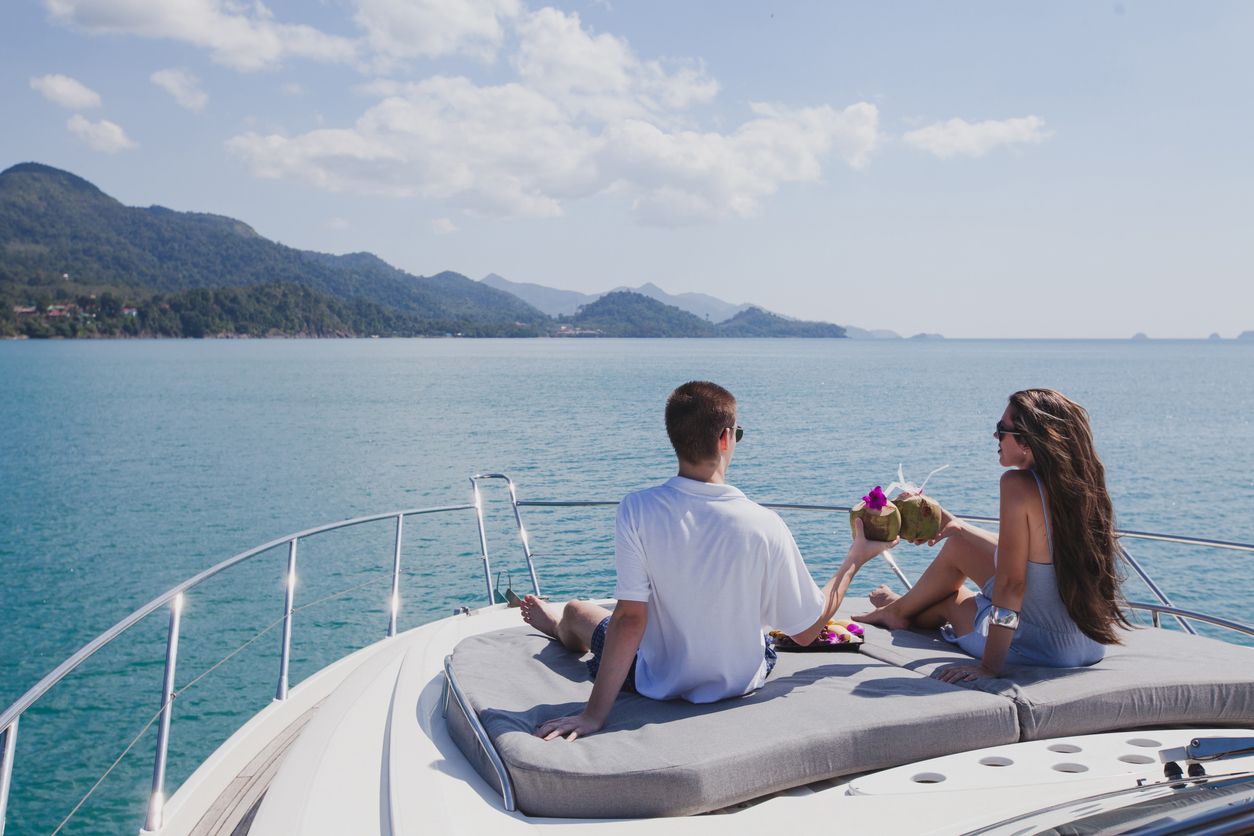Couple enjoying honeymoon onboard of luxury yacht