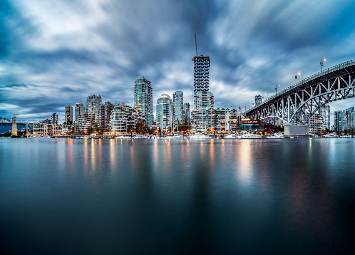 Vancouver waterfront skyline with granville bridge under storm clouds