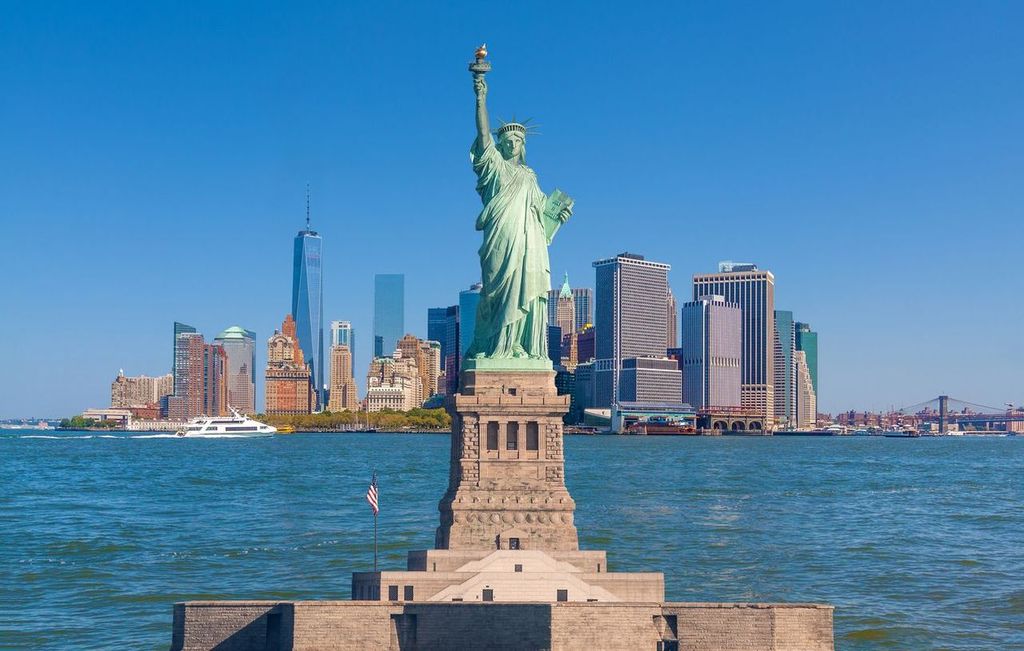 Statue of Liberty and New York City Skyline with Manhattan Financial District, World Trade Center, Water of New York Harbor