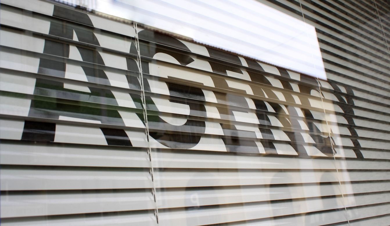 Agency text on the glass window.