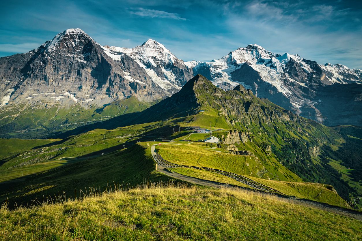  Picturesque snowy mountain ridges and deep valleys with green fields, Lauterbrunnen valley, Bernese Oberland, Switzerland, Europe