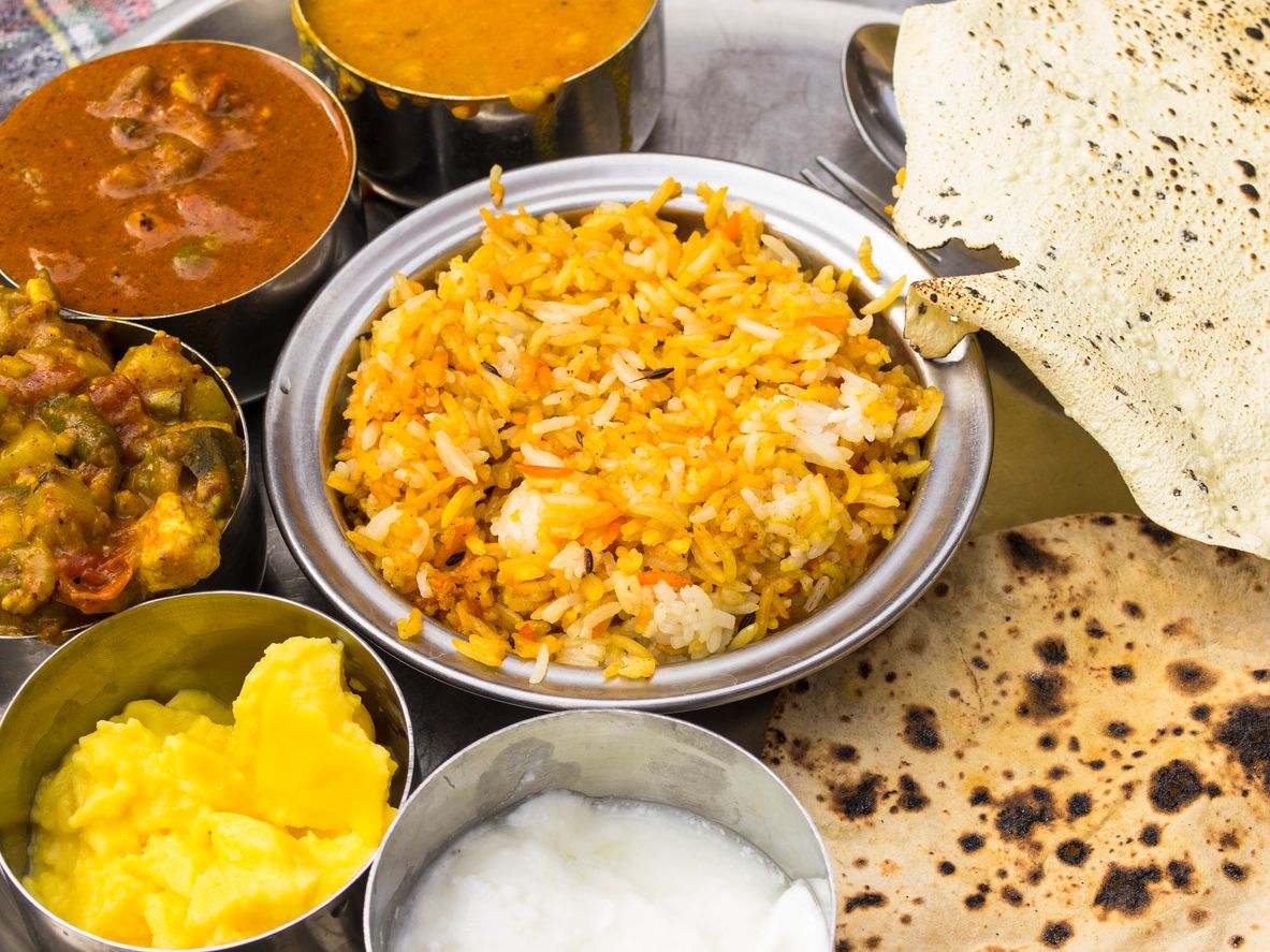 Thali, traditional Indian food with different ingredients and chapatti, Varanasi, India