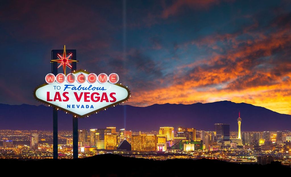 Welcome to Fabulous Las Vegas Nevada sign with the Las Vegas city skyline in the background.