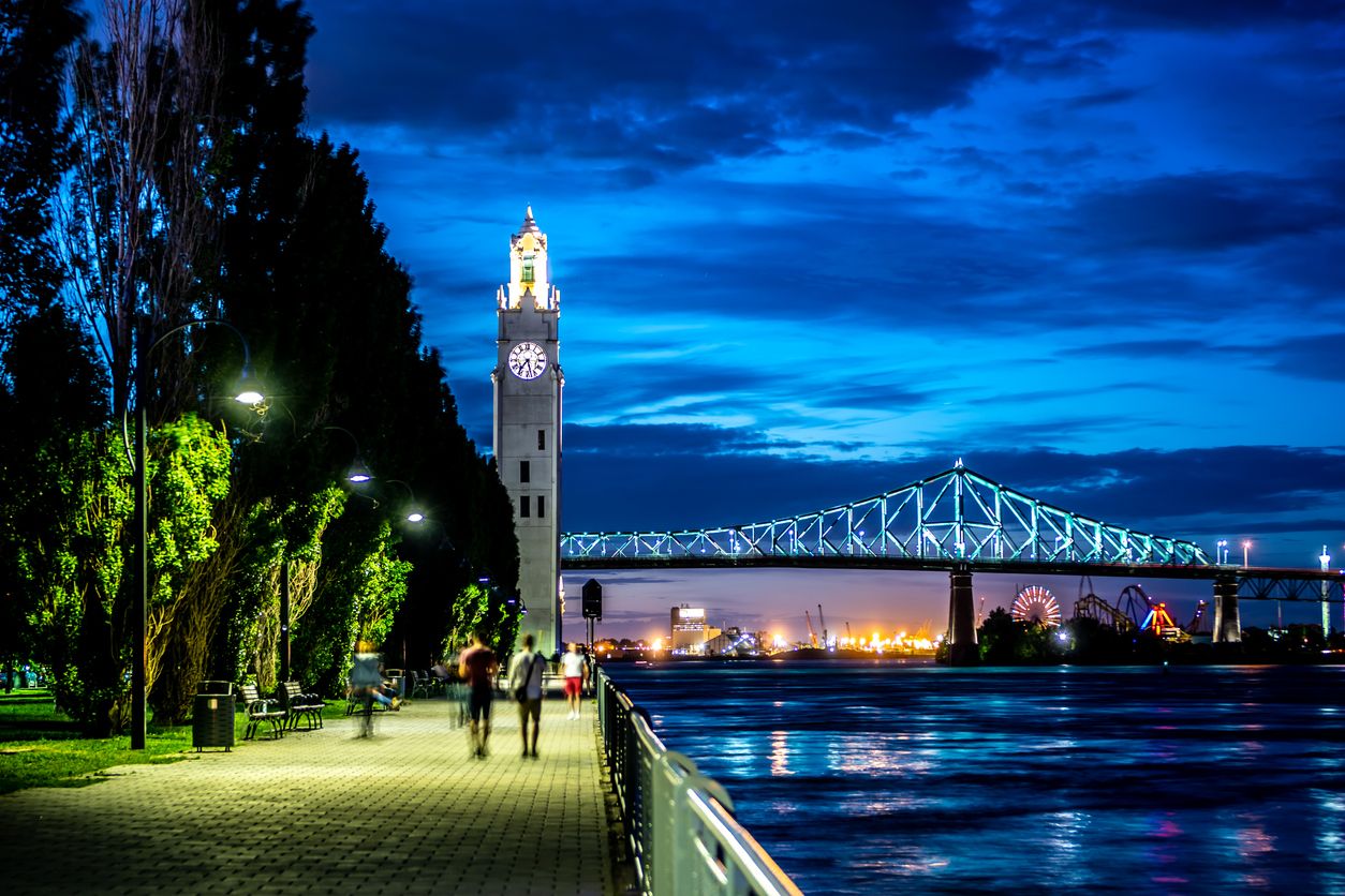 Montreal's old port brighten's up at night with the clock tower and Jacques Cartier bridge illuminating the scenery for visitors and locals