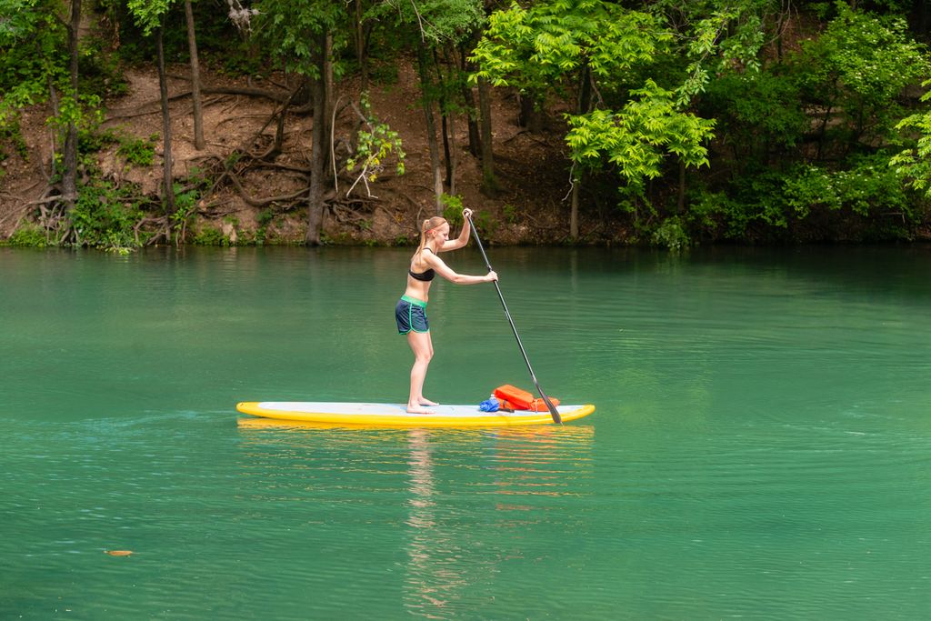 Woman Standup Paddleboarding on the Colorado River in Austin Texas