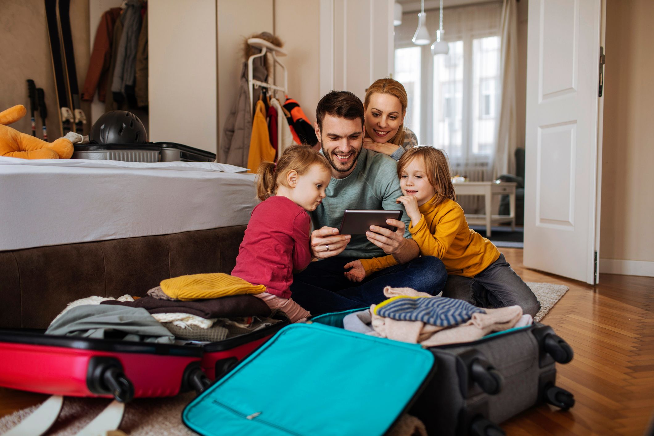 Happy family using tablet their vacation