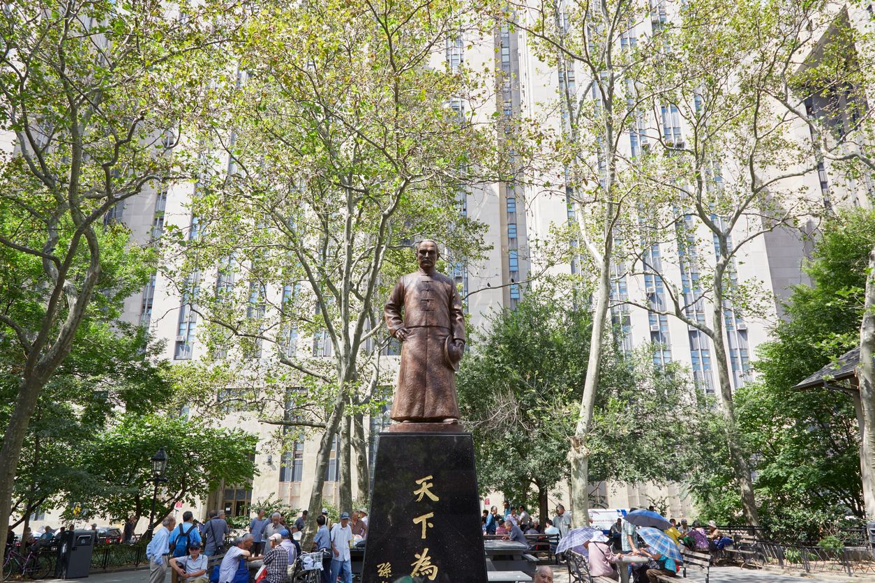 Columbus Park with people playing Chinese Chess and Sen Yat-sen statue in New York