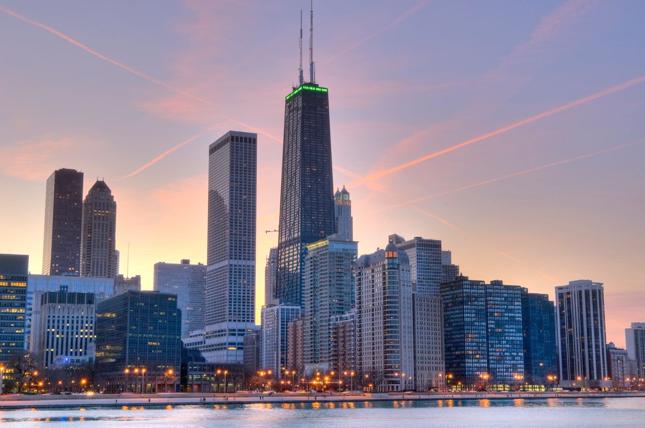 Skyline view at sunset of Northern Chicago with John Hancock Center in focus